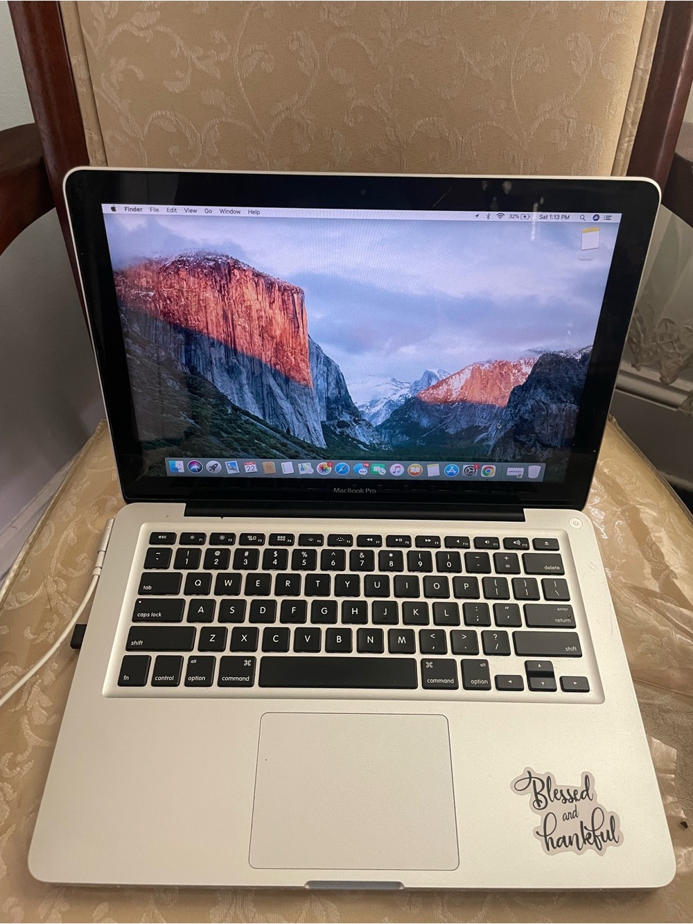 Apple MacBook Pro Silver with Black Keyboard and Sticker
